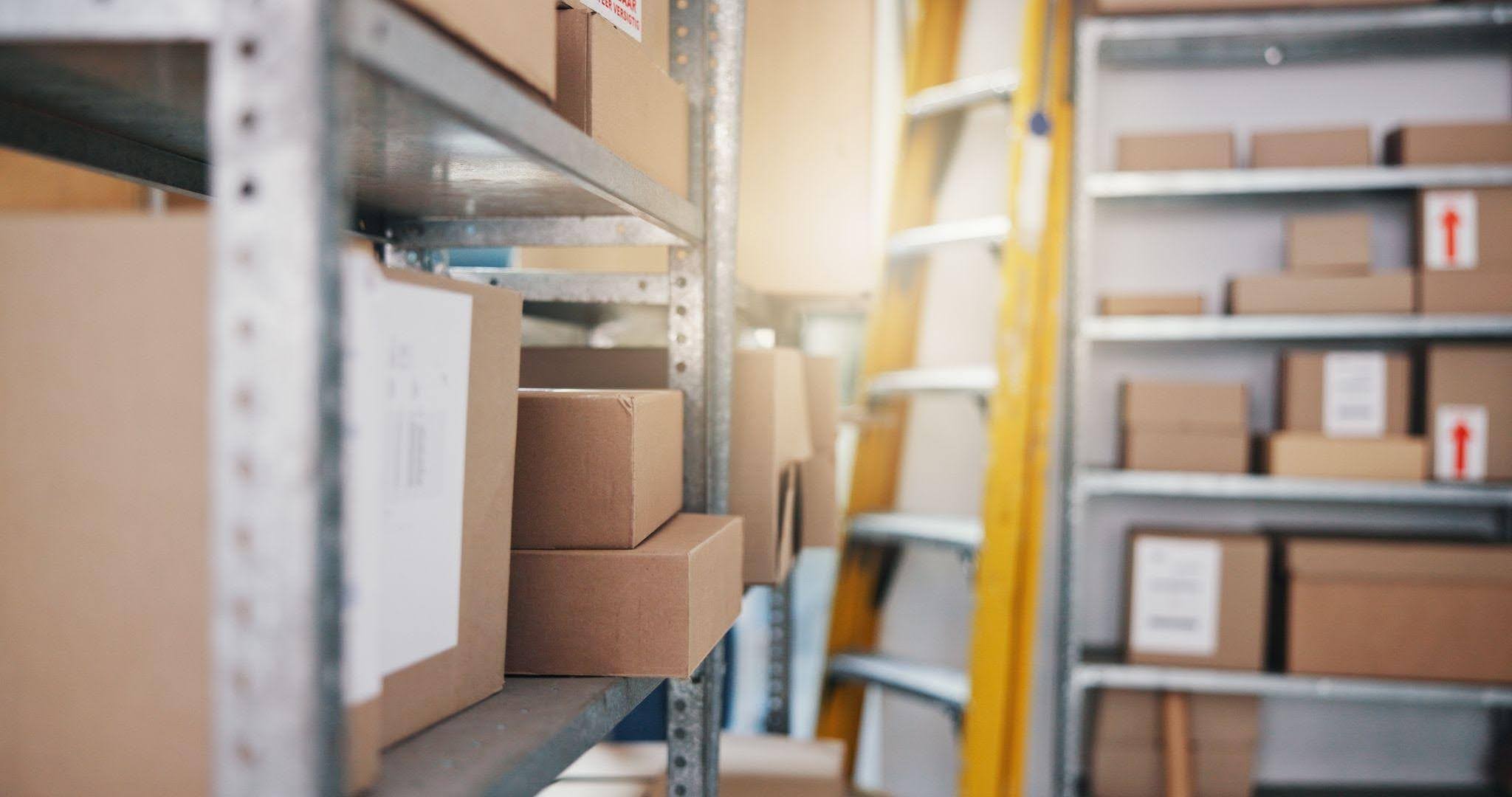 Interior view of a warehouse showcasing shelves lined with boxes